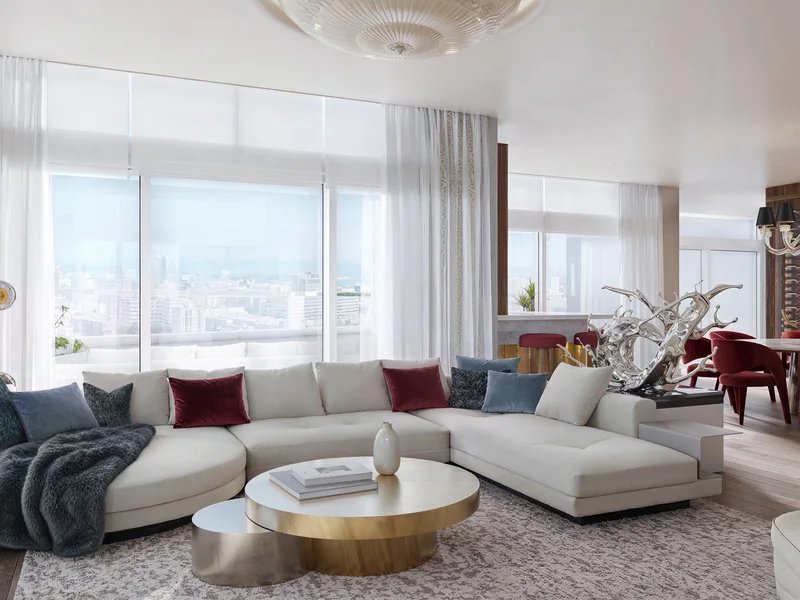 Living room with white sectional, brass coffee table and floor-to-ceiling windows, rendered in 3D